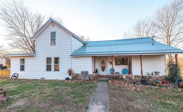 view of front of property with a front yard and a porch