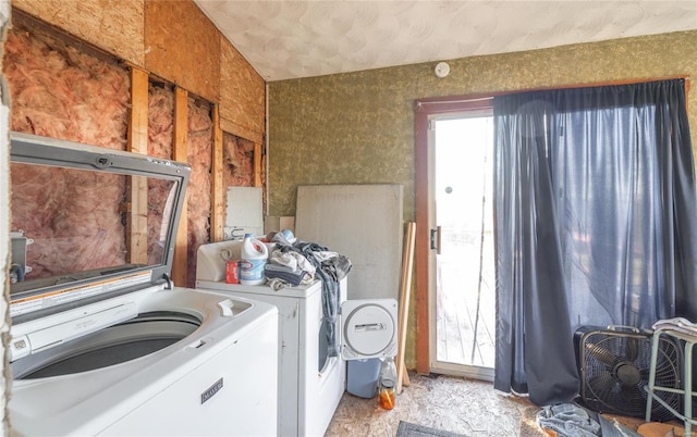 laundry room with washing machine and clothes dryer