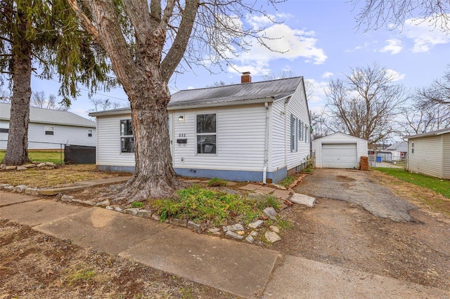 view of front of property with an outbuilding and a garage