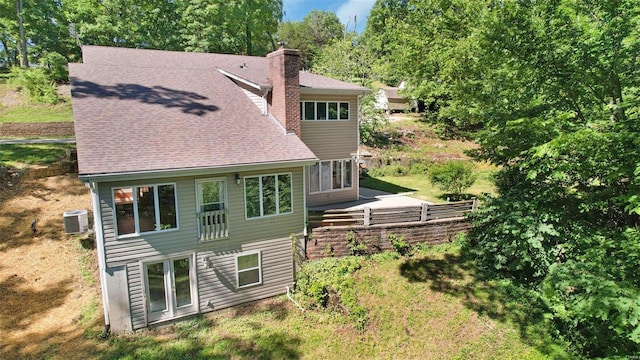 back of house with cooling unit