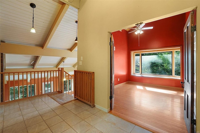 bonus room with vaulted ceiling with beams, ceiling fan, light tile patterned flooring, and wood ceiling