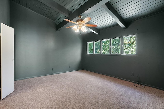 unfurnished room with beamed ceiling, ceiling fan, and light colored carpet