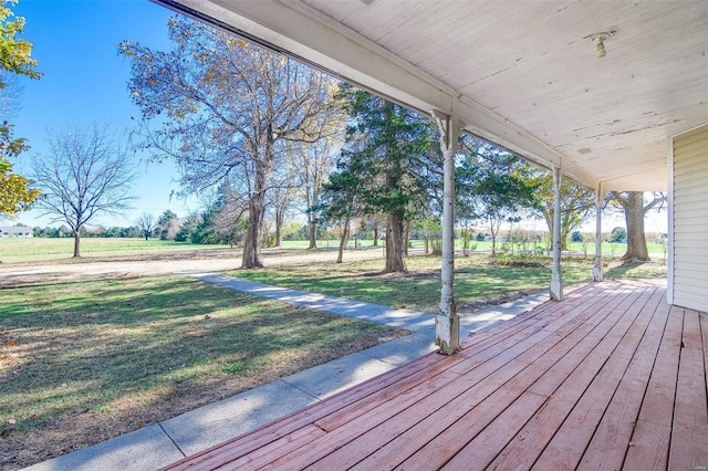 deck with a yard and a porch