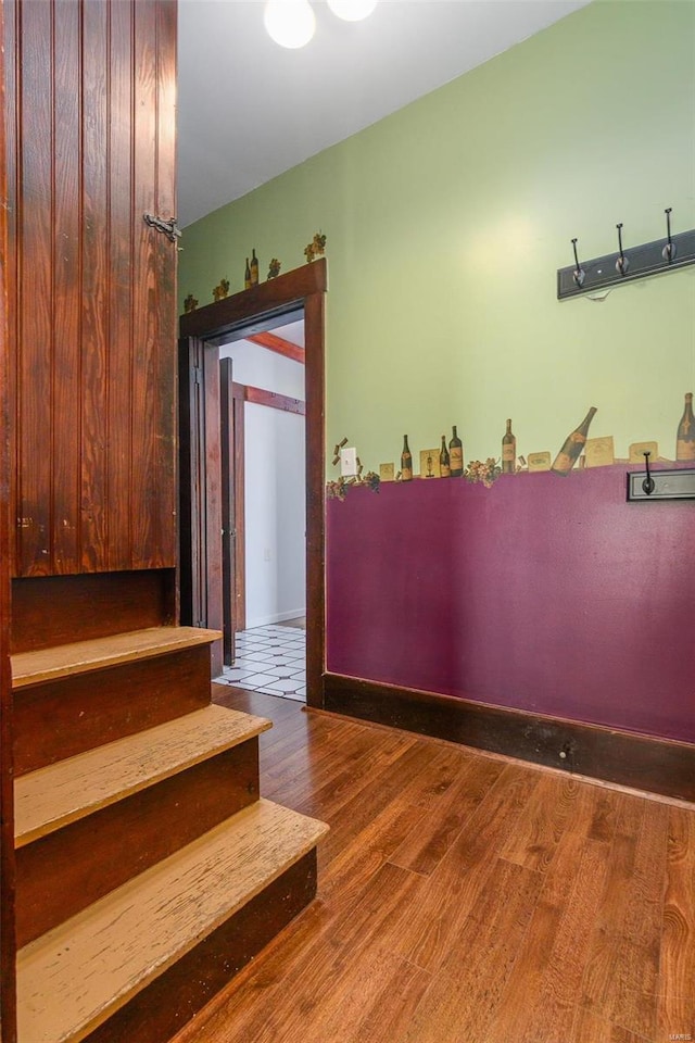 staircase featuring wood-type flooring