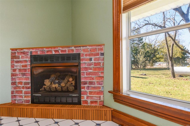 interior details featuring a brick fireplace