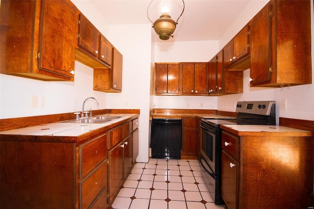 kitchen featuring stainless steel electric stove, tile counters, dishwasher, and sink