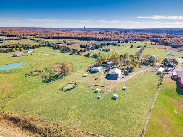 birds eye view of property with a rural view