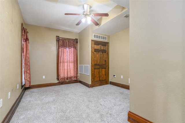 unfurnished bedroom with light colored carpet and ceiling fan