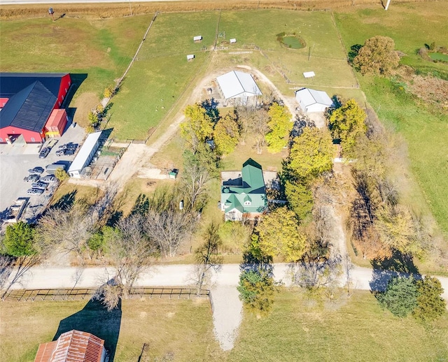 birds eye view of property with a rural view