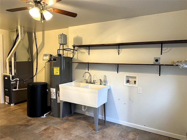 laundry room featuring hookup for an electric dryer, washer hookup, ceiling fan, and water heater