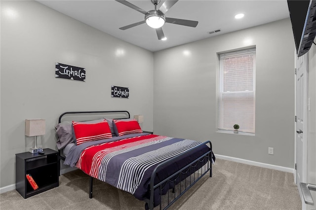 carpeted bedroom with ceiling fan