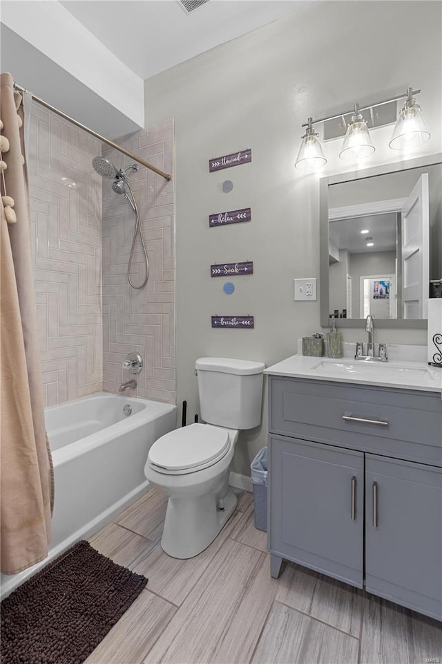 full bathroom with shower / bath combo with shower curtain, vanity, and toilet