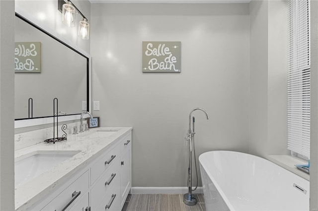 bathroom with vanity and a tub to relax in