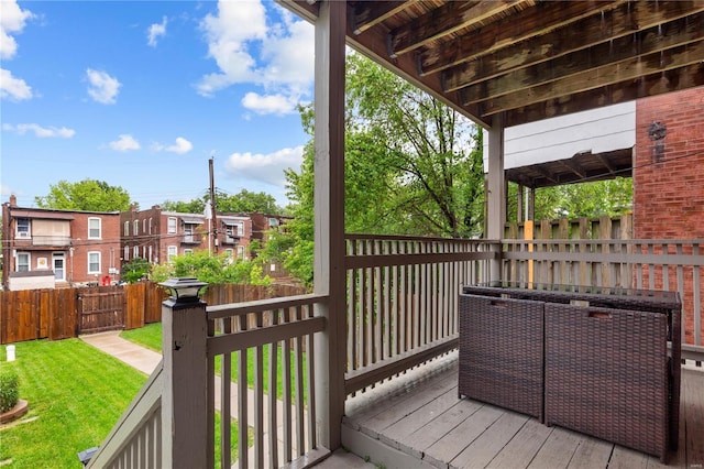 wooden deck with a yard