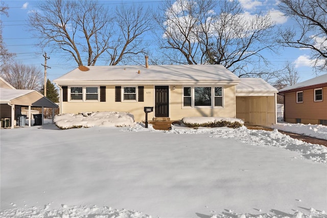 single story home featuring a carport