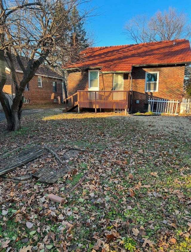 rear view of property with a deck