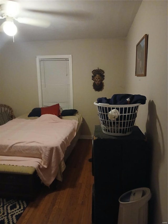 bedroom with ceiling fan and wood finished floors