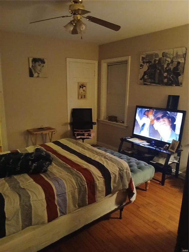 bedroom featuring ceiling fan and wood finished floors