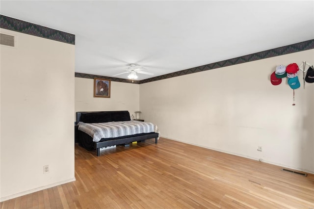 bedroom featuring ceiling fan and light hardwood / wood-style flooring