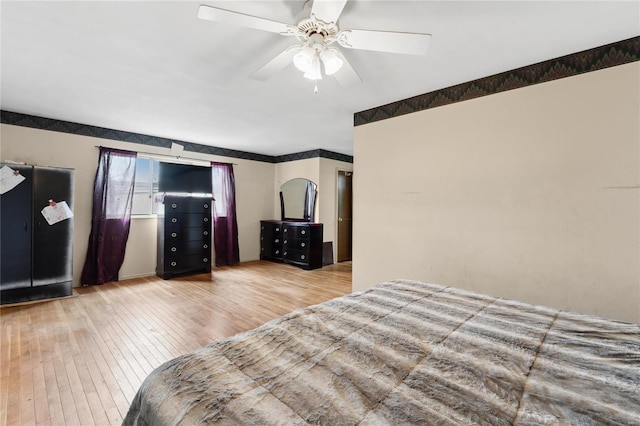 bedroom featuring ceiling fan and light hardwood / wood-style floors