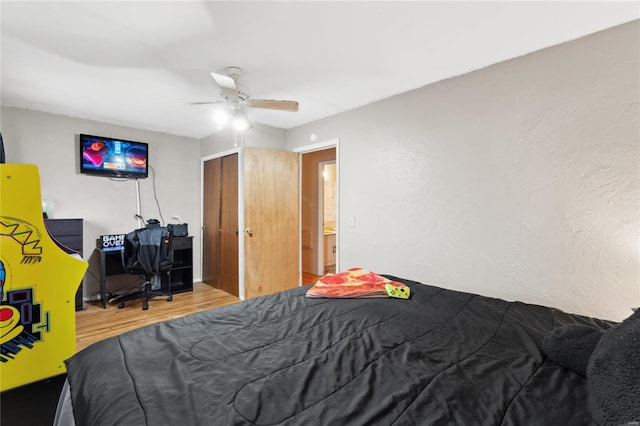 bedroom with hardwood / wood-style flooring and ceiling fan