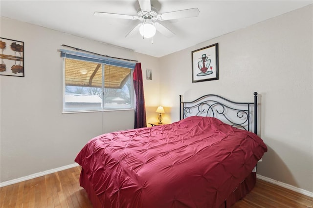 bedroom featuring ceiling fan and wood-type flooring