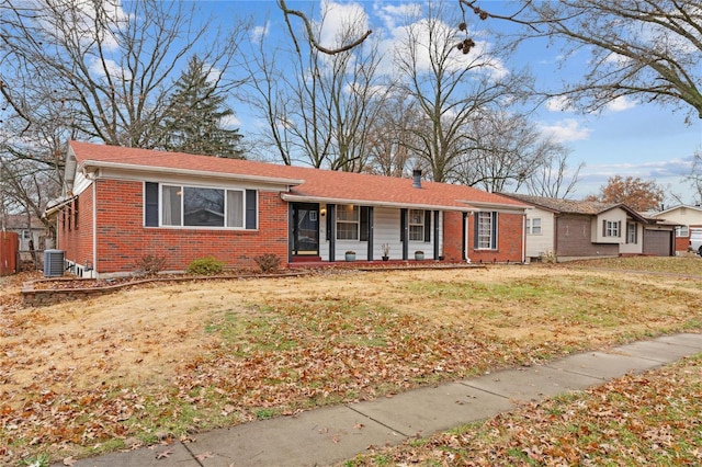 single story home with a front lawn and central air condition unit