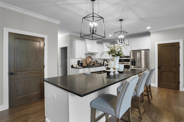 kitchen featuring stainless steel fridge with ice dispenser, white cabinetry, hanging light fixtures, and premium range hood