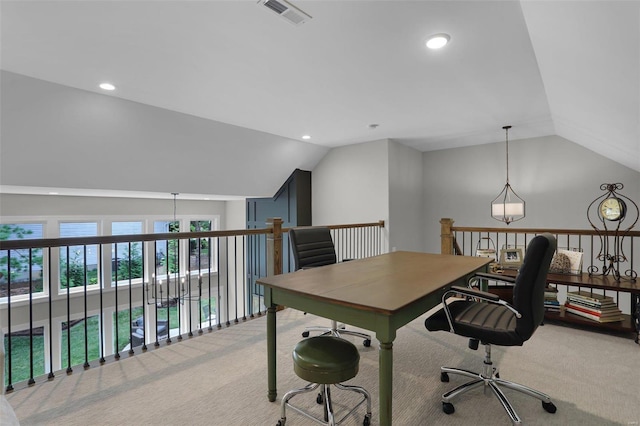 carpeted home office with lofted ceiling