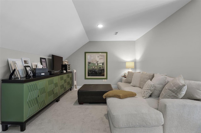 carpeted living room with vaulted ceiling