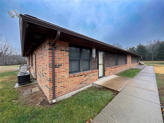 view of property exterior with central AC unit