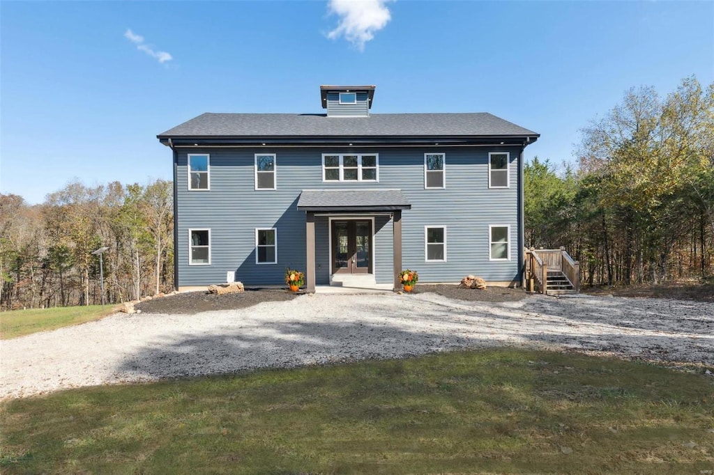 back of house featuring a wooden deck