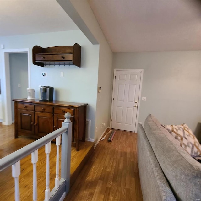 corridor with dark hardwood / wood-style floors