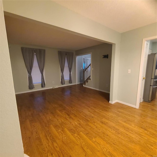 unfurnished room featuring light hardwood / wood-style floors