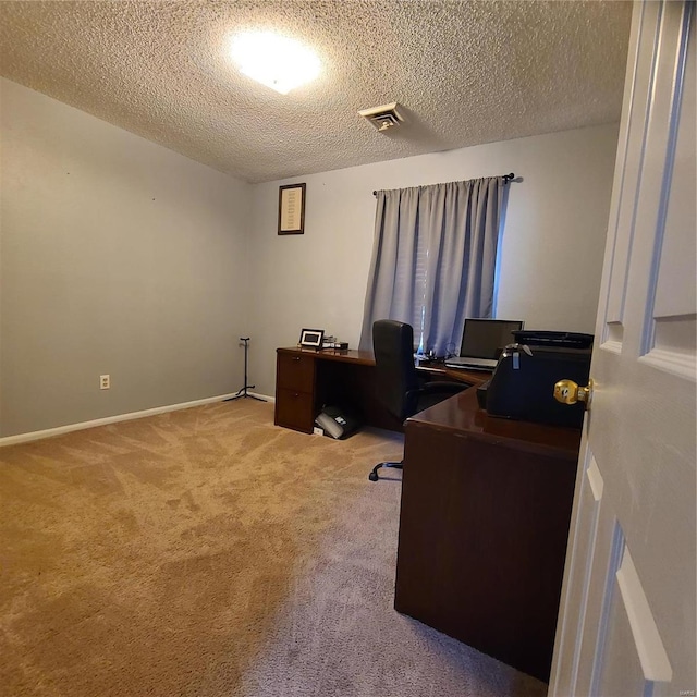 office area with carpet flooring and a textured ceiling