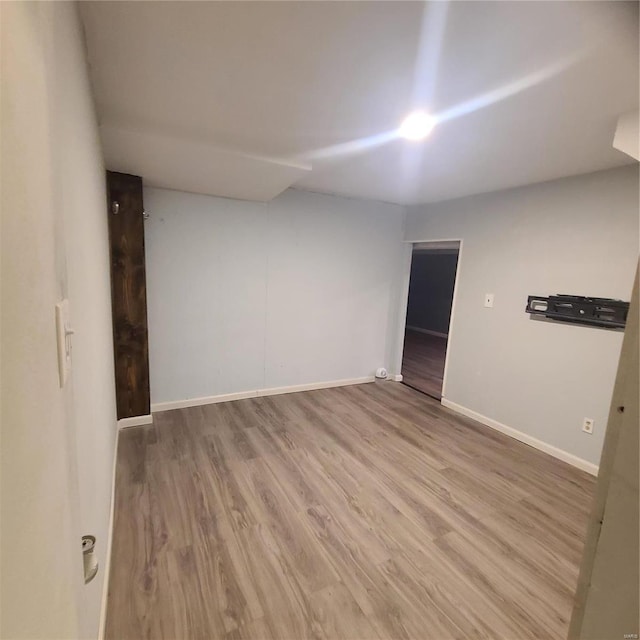 unfurnished room featuring hardwood / wood-style floors