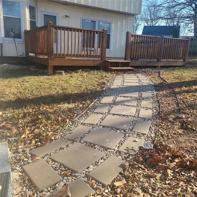 rear view of house featuring a deck