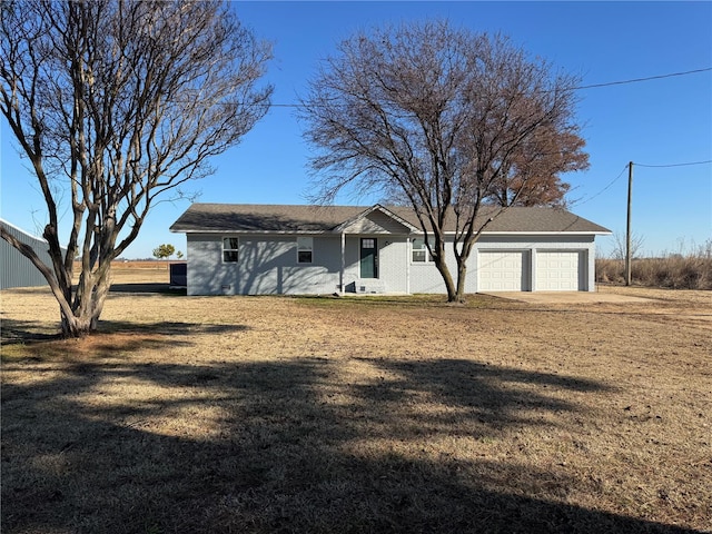 ranch-style home with a garage and a front yard