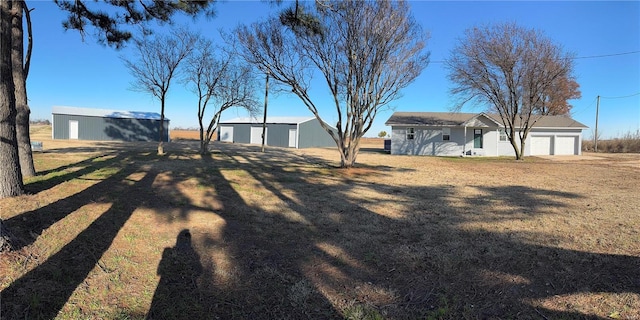 view of yard with a garage