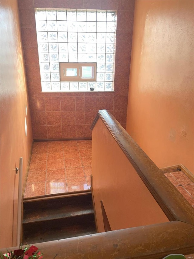 stairs featuring tile patterned floors