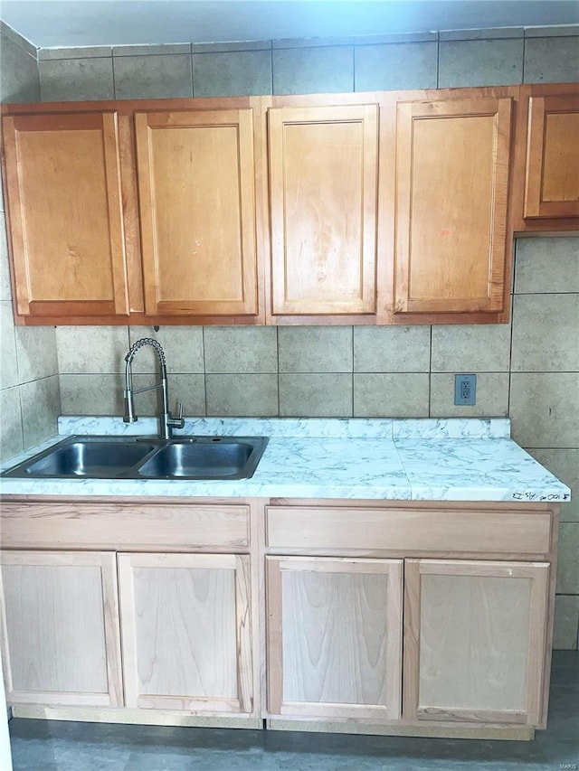 kitchen with decorative backsplash and sink