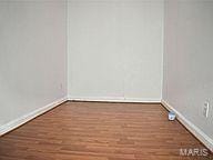 spare room with dark hardwood / wood-style floors