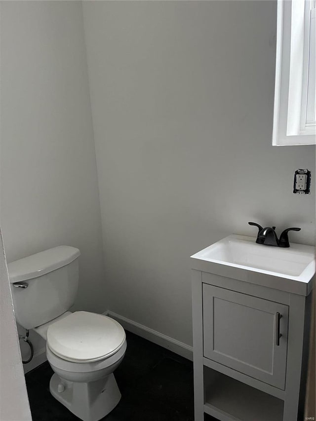 bathroom with vanity and toilet