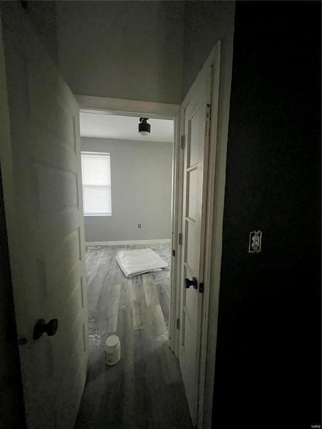 hallway with wood-type flooring