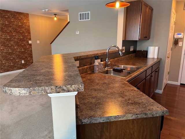 kitchen with sink and kitchen peninsula