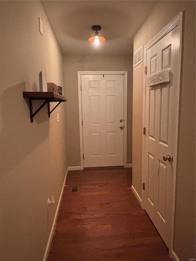 hall with dark hardwood / wood-style floors