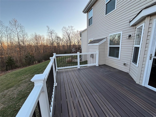 deck at dusk with a lawn