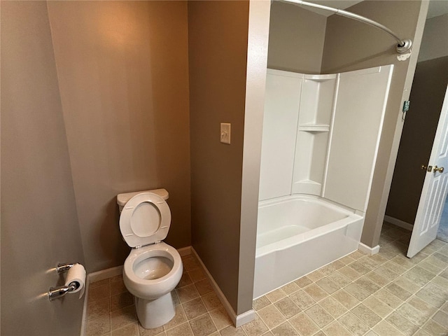 bathroom with toilet and washtub / shower combination