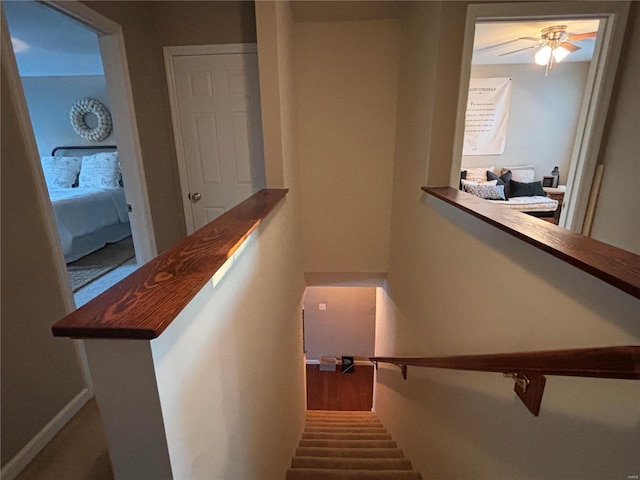 stairs with ceiling fan