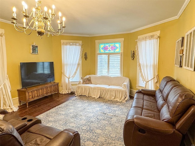 living room with a notable chandelier, dark hardwood / wood-style floors, and ornamental molding